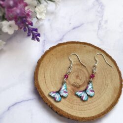Silver plated, enamelled pink white and blue butterfly charm earrings